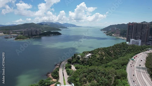 Sham Tseng Ting Kau Tsing Lung Tau Castle Peak Road and Tuen Mun Road Highway Flyover Traffic Roads are built along the slopes of the curved coastline with embankments bridges and culverts  photo