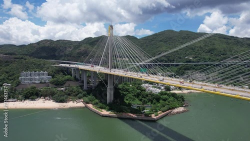 Ting Kau Bridge is the world's first three-tower cable-stayed bridge connecting Tuen Mun Tsuen Wan Sham Tseng and Tsing Yi, a three-lane dual-divided expressway traffic highway flyover infrastructure  photo