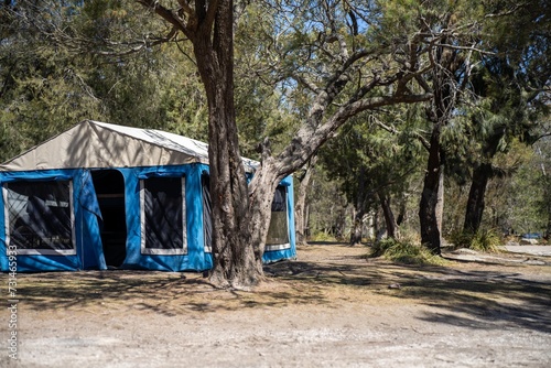 camper trailer tent set up camping in a park in the forest on a hoilday in australia © William