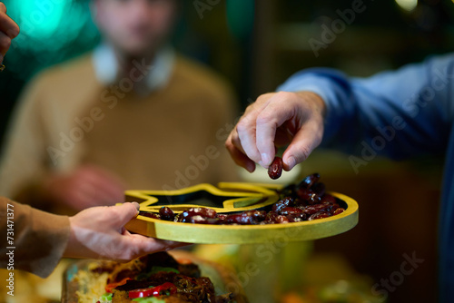 In this modern portrayal, a European Islamic family partakes in the tradition of breaking their Ramadan fast with dates, symbolizing unity, cultural heritage, and spiritual observance during the holy