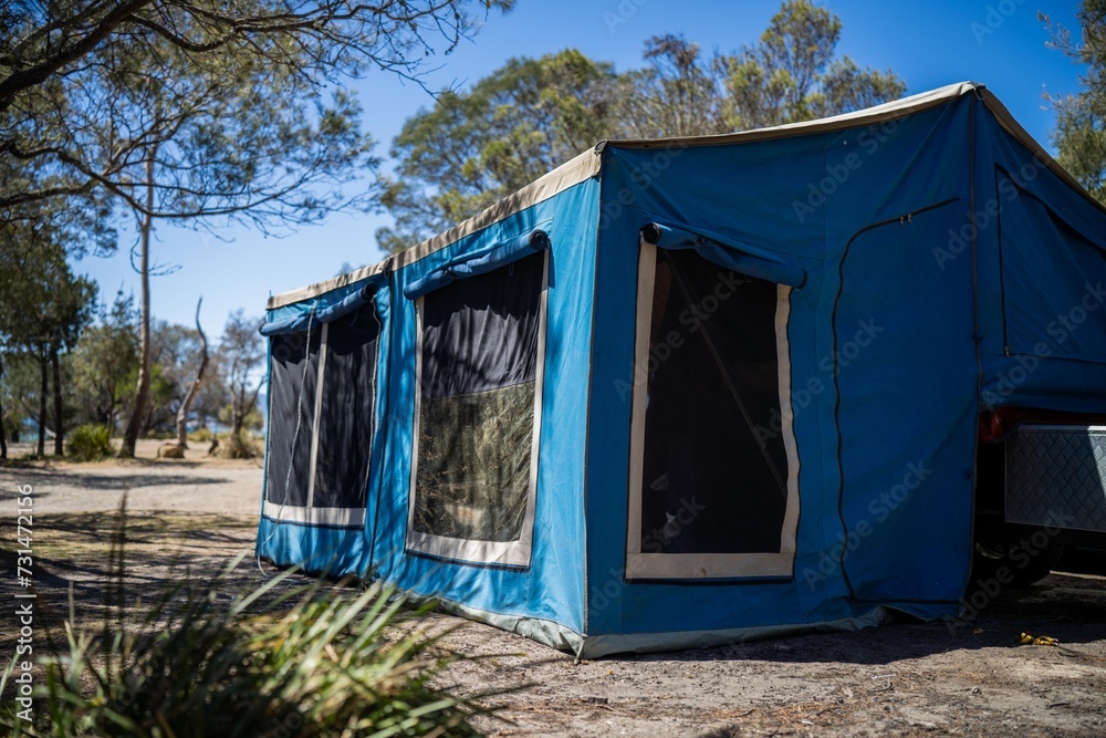 camper trailer tent set up camping in a park in the forest on a hoilday in australia camper trailer tent set up camping in a park in the forest on a hoilday in australia