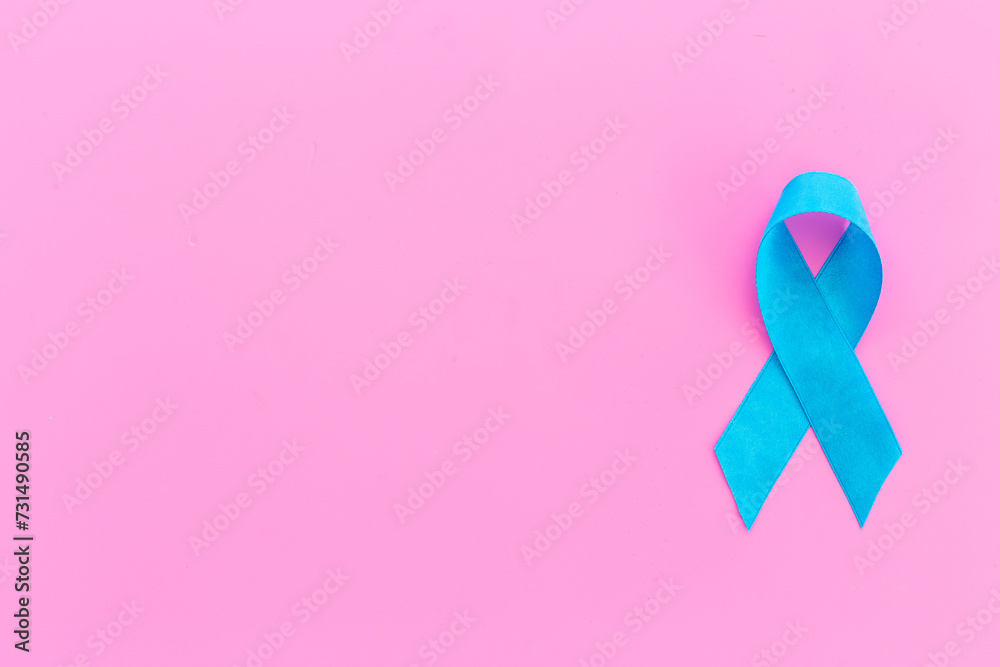 Blue ribbon symbol of prostate or colon cancer awareness concept Blue ribbon symbol of prostate or colon cancer awareness concept