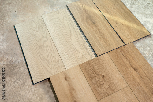 Top View Luxury Vinyl Wood Samples Lying On Concrete Floor In House. Choosing  Selecting Waterproof Flooring. Home Reconstruction. Vinyl Tiles Collection  Patterns. Interior Design Idea. Horizontal.