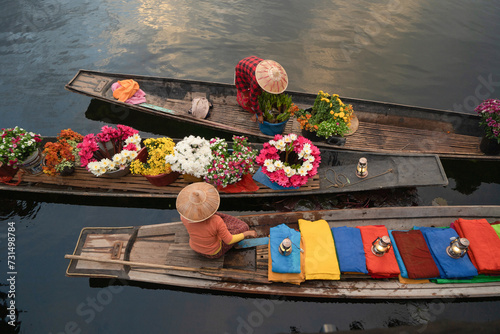 Damnoen Saduak Floating Market or Amphawa. Local people sell fruits, traditional food on boats in canal, Ratchaburi District, Thailand. Famous Asian tourist attraction destination. Festival in Asia. photo