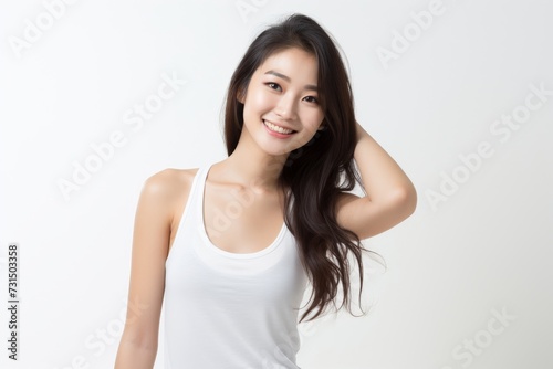 Sweet little girl donning comfy vest lingerie, posing with confidence on a clean white surface. Generative AI.