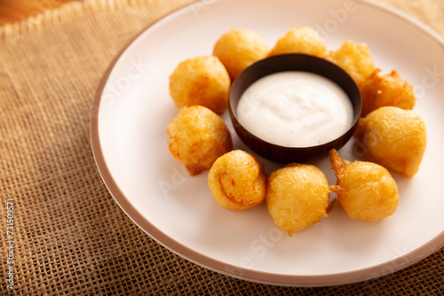 Fried breaded cheese balls, easy and delicious homemade snack recipe. Served with dipping sauce.
