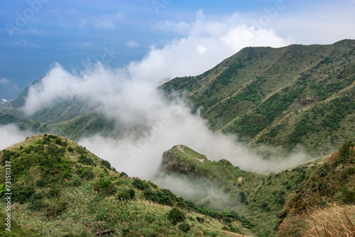 Overlook the mountain with amazing fog surrounding it in Jinguashi, New Taipei City, Taiwan.
