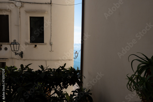 Fototapeta Naklejka Na Ścianę i Meble -  White old houses and narrow streets in medieval small touristic coastal town Sperlonga, Latina, vacation in Italy