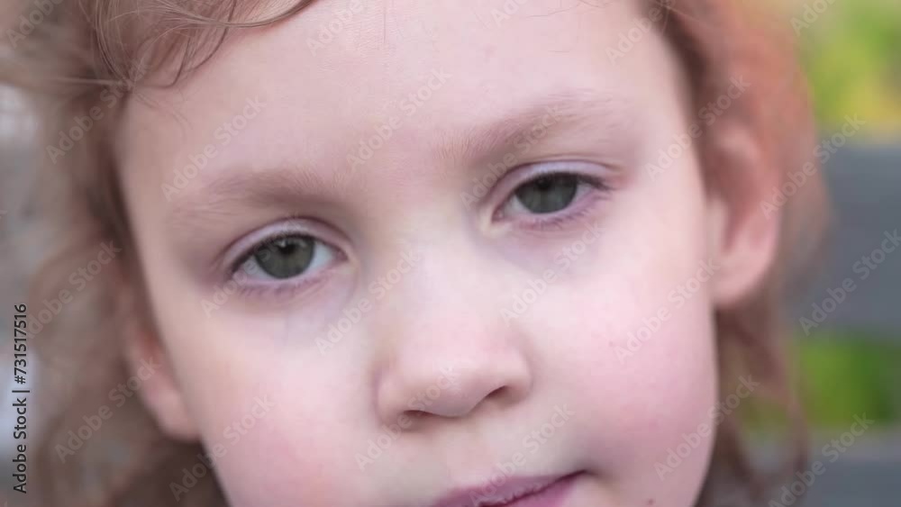 fair-haired curly girl looking into the camera fair-haired curly girl looking into the camera