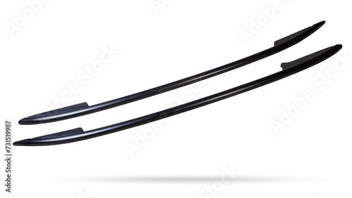 A pair of black roof rails for securing luggage on the roof of a car on a white isolated background. Spare parts catalogue.