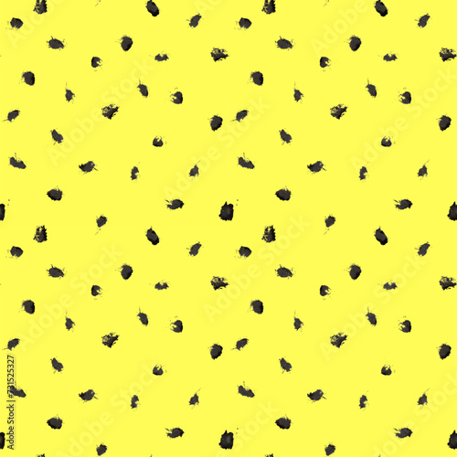 Dash pattern on yellow background. Wrapping paper with small black dots painted with a brush. Seamless simple minimal ornament. Abstract geometric grunge vector texture painted by ink.