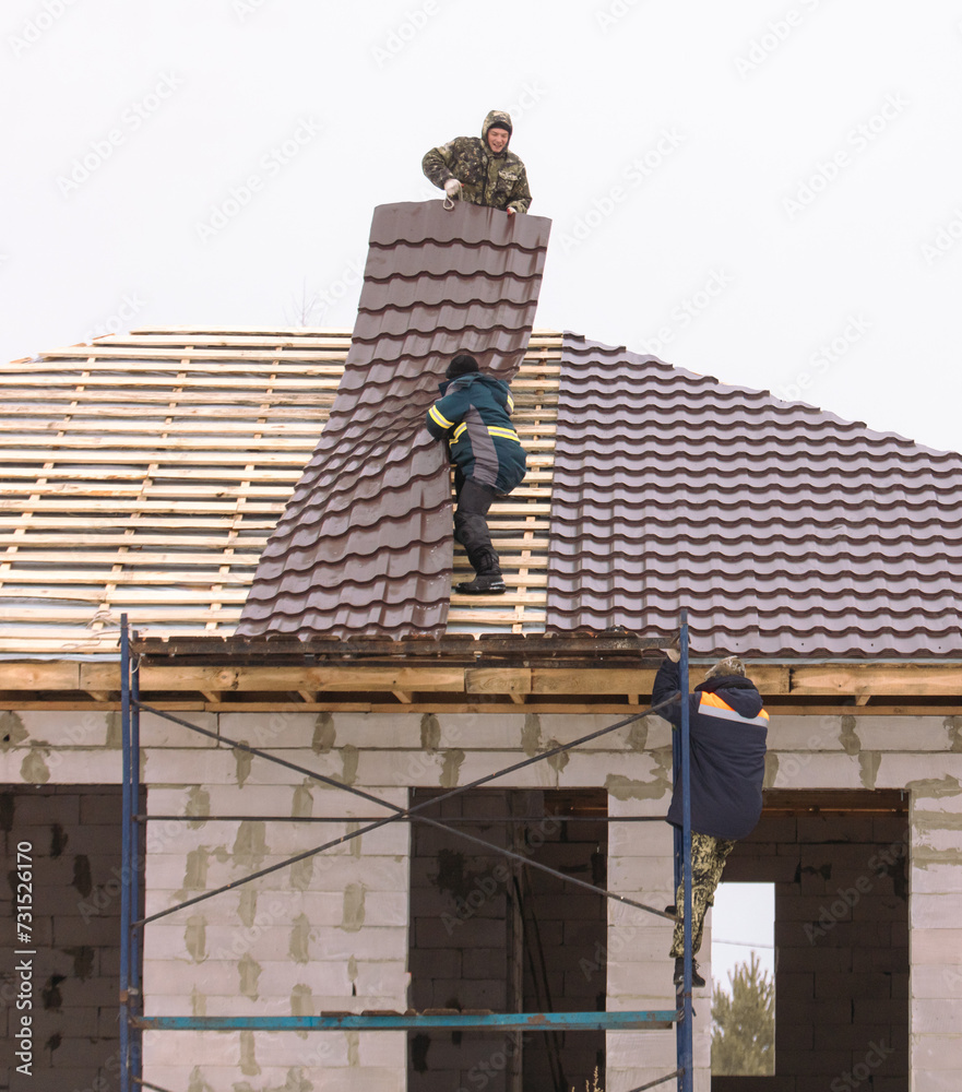 custom made wallpaper toronto digitalWorkers install tiles on the roof of a house in winter