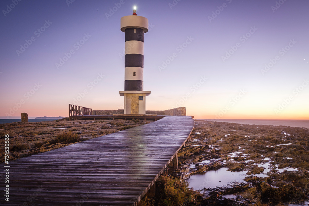Fototapeta premium strong waves on the Puntassa lighthouse in Colònia de Sant Jordi, ses Salines, Mallorca, Balearic Islands, Spain