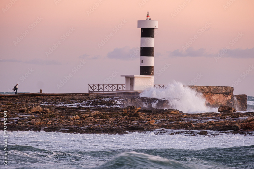strong waves on the Puntassa lighthouse in Colònia de Sant Jordi, ses Salines, Mallorca, Balearic Islands, Spain