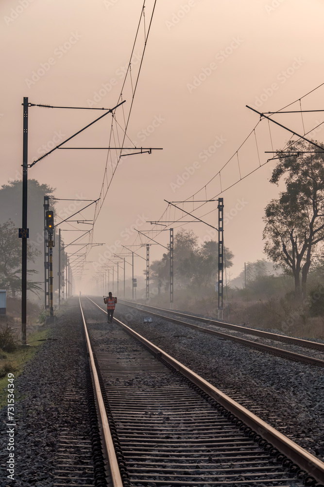 An Indian railway gangman at work near Pune India. Gangmen inspect and maintain railway tracks for the Indian Railways.