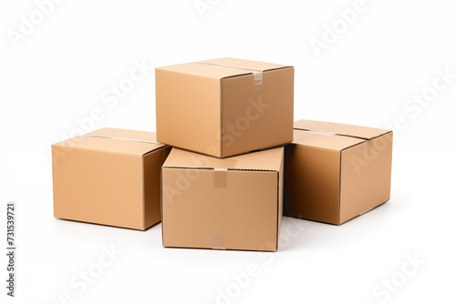 four raw kraft cardboard boxes closed and stacked isolated on white background