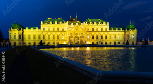 Illuminated Upper Palace in historical complex Belvedere at night, Vienna, Austria