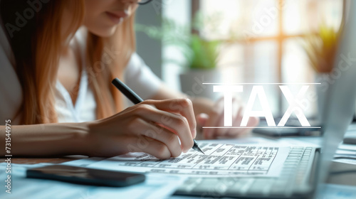 Closeup business woman filling form of individual income Tax return, Accounting, Statistics and analytic research concept