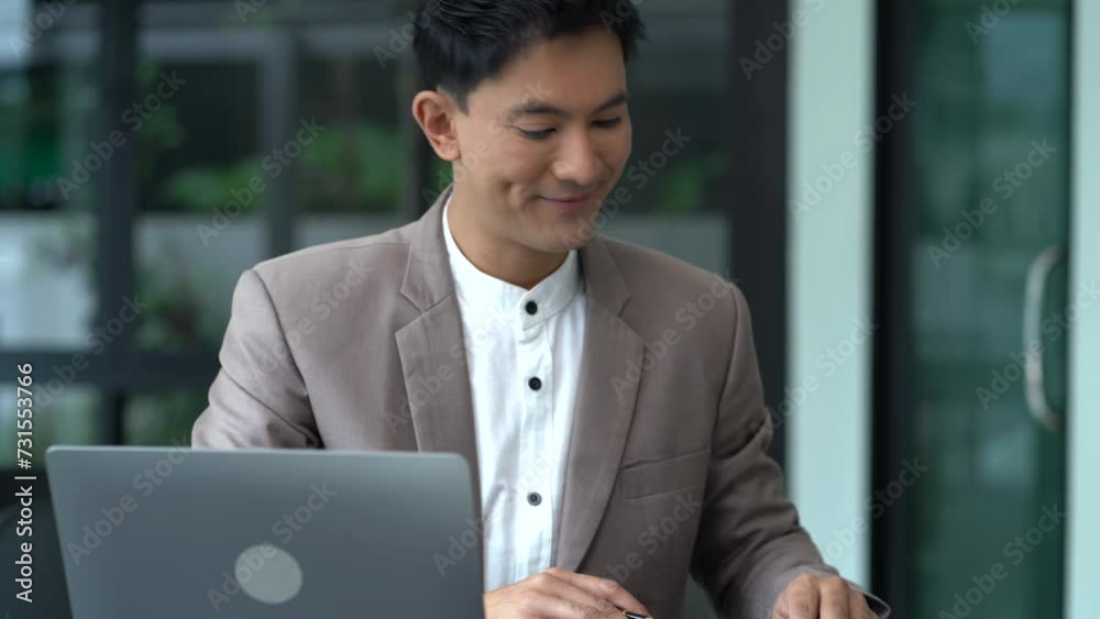 Businessman using laptop computer in office. Happy man, entrepreneur, small business owner working online. Businessman using laptop computer in office. Happy man, entrepreneur, small business owner working online.