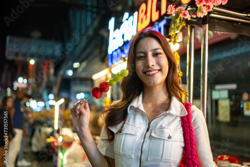 Portrait of Caucasian women traveling outdoors in the city at night. 