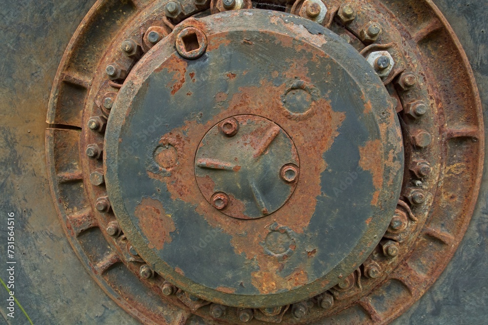 Closeup of old rusty wheel rim of haul truck.