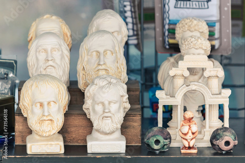 Plaster bust of philosophers Aristotle, Epictetus and group of other busts. Portraits of ancient historical persons. Mass-product souvenir in Turkey. Copy space, selected focus photo