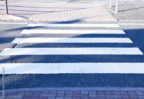 Zebra crossing white black traffic walkway road. Important part that helps make the roads safe and helps reduce accidents. Drivers must obey traffic signals or traffic signs. Symbols for road traffic.