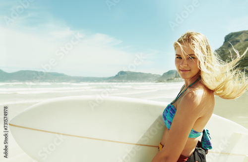 Canvas Print Portrait, wind and woman on beach with surfboard in summer for sports, travel or vacation on coast