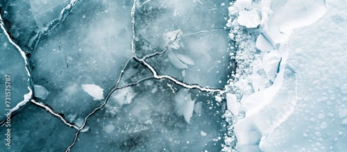 Cracks on frozen water, top view of ice floes in glacier and iceberg landscape, winter nature background. photo