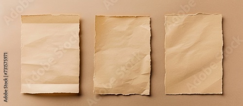 Three rectangular brown paper bags are placed on a wooden surface, showcasing various tints and shades of brown, including beige and peach.