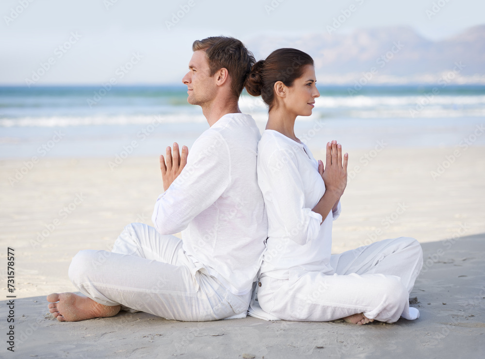 Couple, yoga and beach with meditation, sitting and peace on sand in morning with mindfulness in summer. Man, woman and outdoor for namaste with spiritual growth, balance or zen by ocean in Cape Town