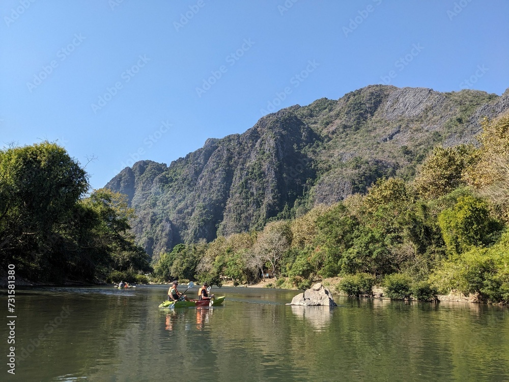Nam Song River at Vang Vieng Laos. Beautiful kayak trip on the river nextto huge mountains and beautiful nature. Holday time