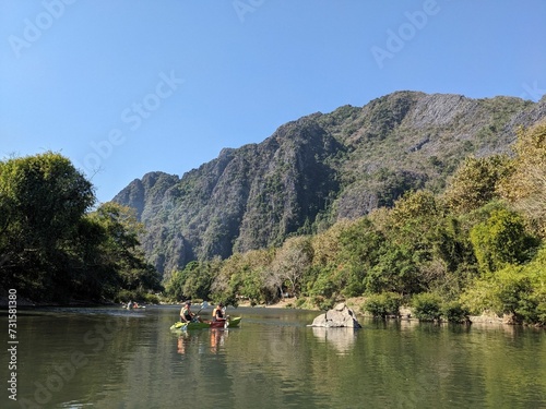 Nam Song River at Vang Vieng Laos. Beautiful kayak trip on the river nextto huge mountains and beautiful nature. Holday time © SimonMichael