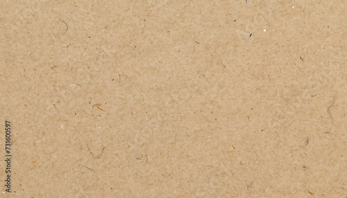 Light brown kraft paper texture background, close-up view of a textured, beige-colored surface with small, scattered fibers