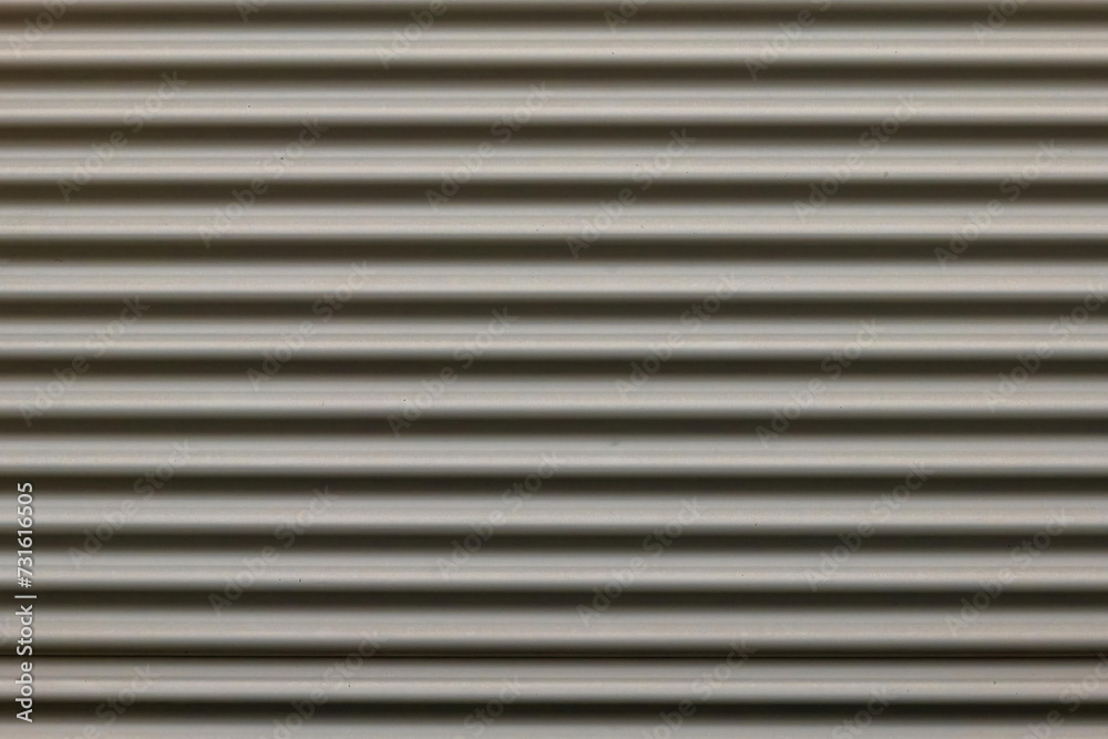 a gray corrugated iron wall in the city a gray corrugated iron wall in the city
