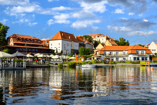 View of the center of Ryn, the castle, the lake and the marina with moored boats., Masuria, Poland.