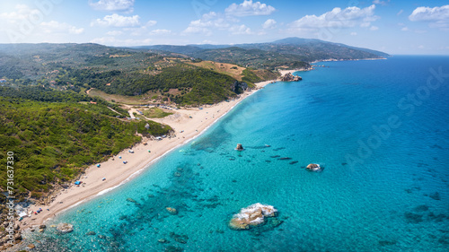 Fototapeta Naklejka Na Ścianę i Meble -  Aerial view of the beautiful beach of Melani, Mount Pelion, Greece, with turquoise sea and lush vegetation