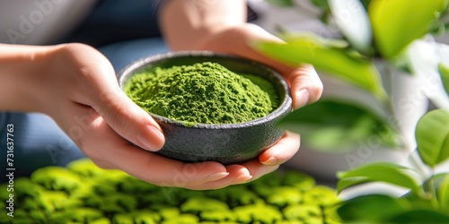 woman hand holding matcha tea powder on bowl, prepare Japanese green Matcha tea