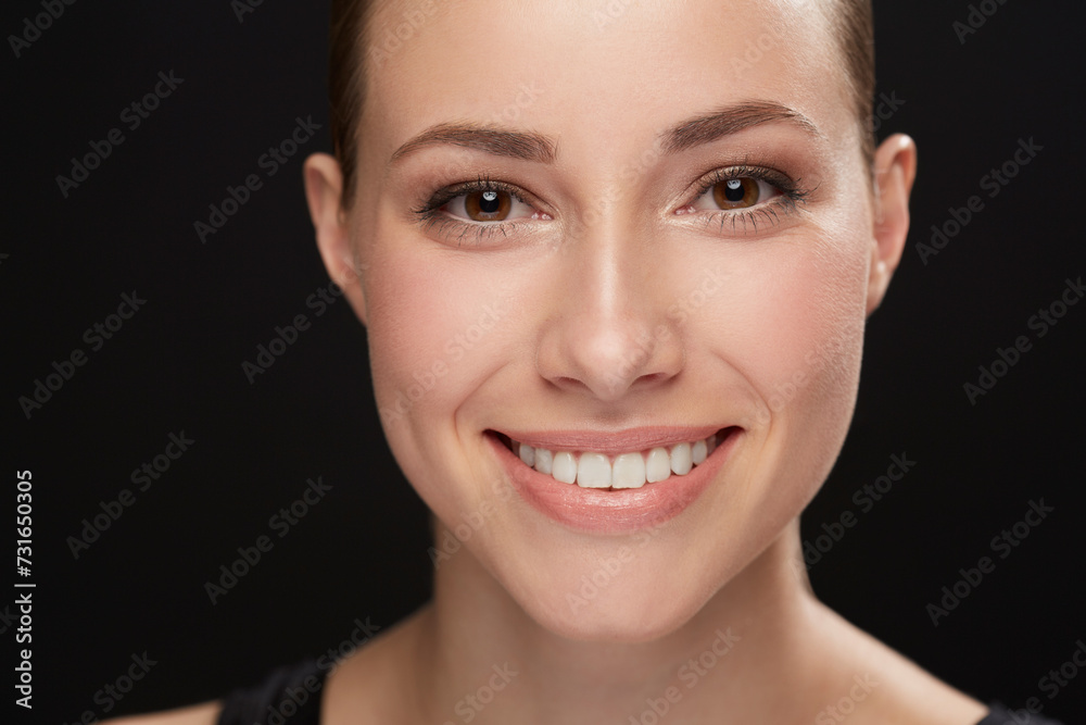 Obraz premium Model, happiness and portrait in studio with cosmetics, closeup and beauty results of cosmetology in mockup. Woman, face and skincare with retinol for glow, facial and make up on black background