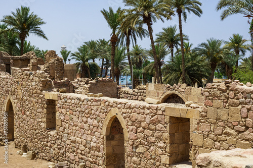 Antick ruins of Aqaba Fortress walls, or Aqaba Castle, Mamluk Castle, Jordan. Fortress was built by Crusaders in the 12th century. Aqaba Castle has quadrangular shape with stone towers at corners. photo