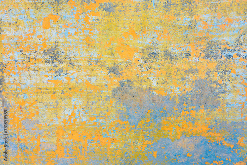 Painted mural bohemian background. Abstract art wall with peeled paint texture like an old fresco. Reminiscences of India. Pastel colors, oranges, greens and blues. photo