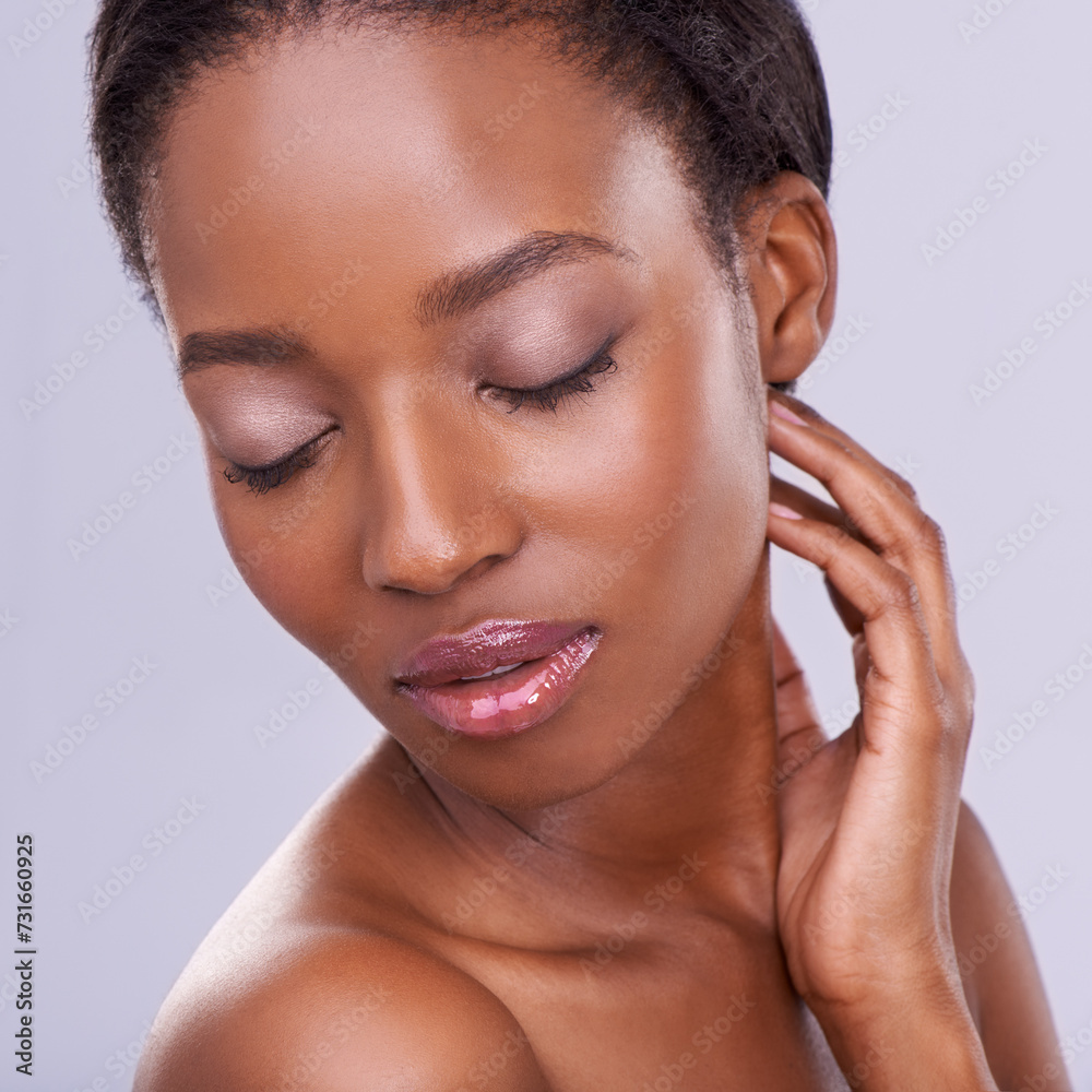 Beauty, dermatology and face of black woman with calm, glowing skin and natural spa makeup in studio. Relax, skincare and luxury cosmetics with healthy facial of girl isolated on purple background.