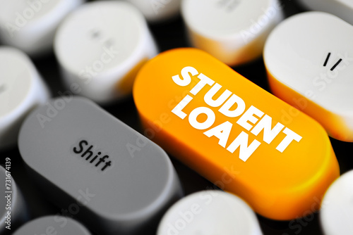 Student Loan is a type of loan designed to help students pay for post-secondary education and the associated fees, text concept button on keyboard