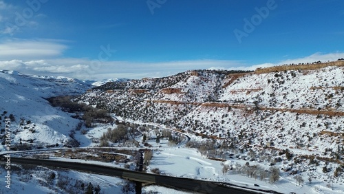 Εκτύπωση καμβά Aerial view of snow covered mountain landscape under blue sky