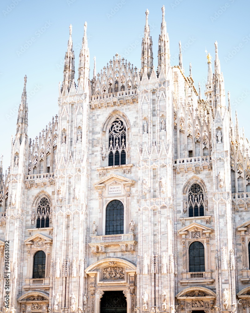 Awe-inspiring view of Milan Cathedral in Italy with intricate sculptures adorning its exterior