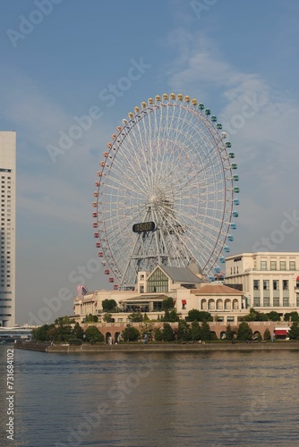 Vertical shot of a large ferris wheel on the shore in Yokohama  Japan