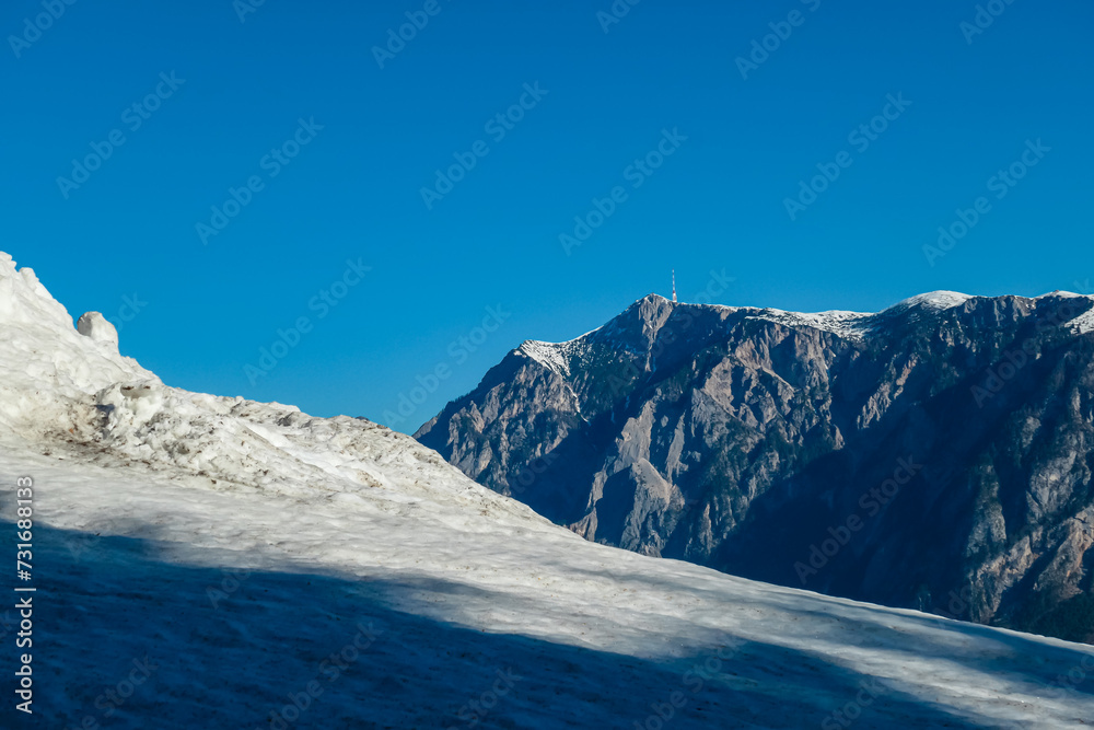 Panoramic view of majestic mountain peak Dobratsch seen from Dreilaendereck (Pec, Often, Monte Forno) in untamed Karawanks, Carinthia, Austria. Alpine landscape in spring in Austrian Alps. Wanderlust