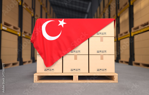 Crate boxes on wooden pallets with Turkey flag, Cartons Cardboard Boxes in the warehouse. 3D illustration