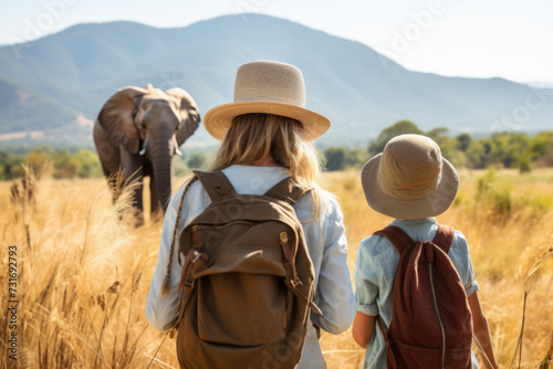 Safari Exploration: Mother and Child Observing Elephant in the Wild