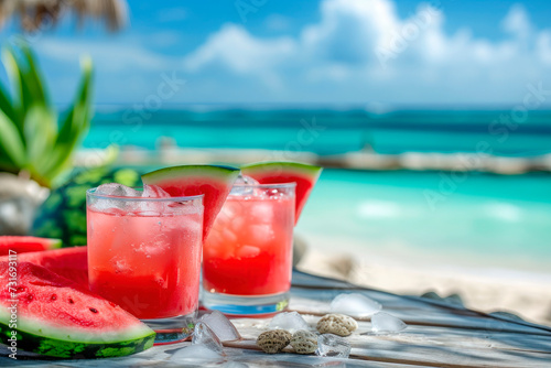 Watermelon drink in glasses with slices of watermelon with beach background. Copy space
